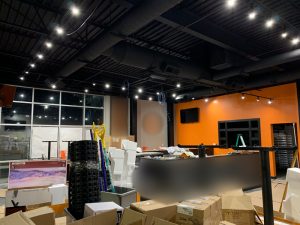 Black Track Lighting Suspended from Black Architectural Ceiling